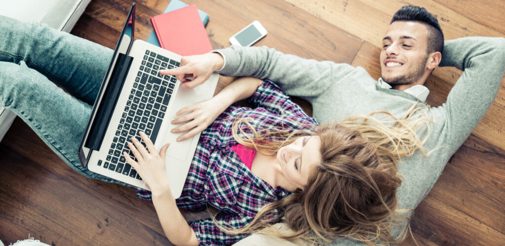 Couple looking at computer laptop